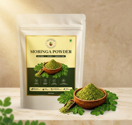 DHANROVA Organic Moringa Powder with fresh moringa leaves and a wooden bowl of moringa powder.